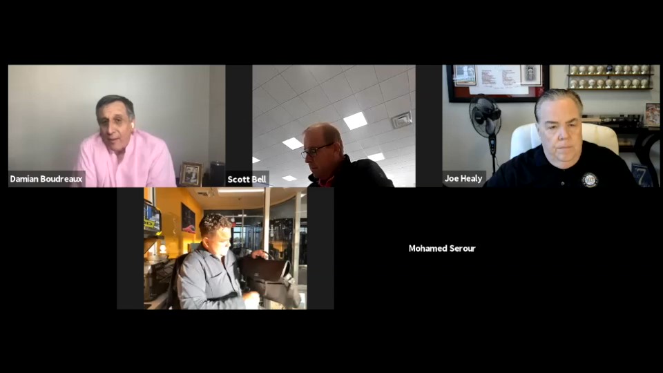 Damian Boudreaux in pink shirt in 100 Cars Club Zoom call with members talking about Optimistic Uncertainty